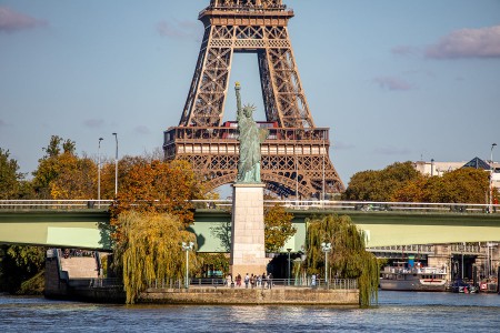 View of the Statue of Liberty in Paris with the Eiffel Tower in the background